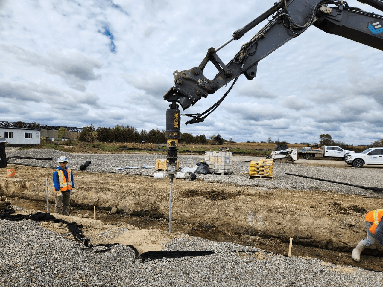 Helical pile installation on a construction site